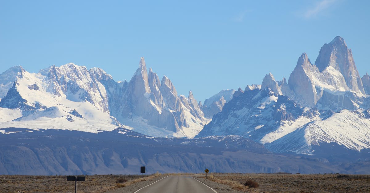 Is it practical to travel in Argentina with limited knowledge of Spanish? - Snow Covered Mountains Under the Blue Sky