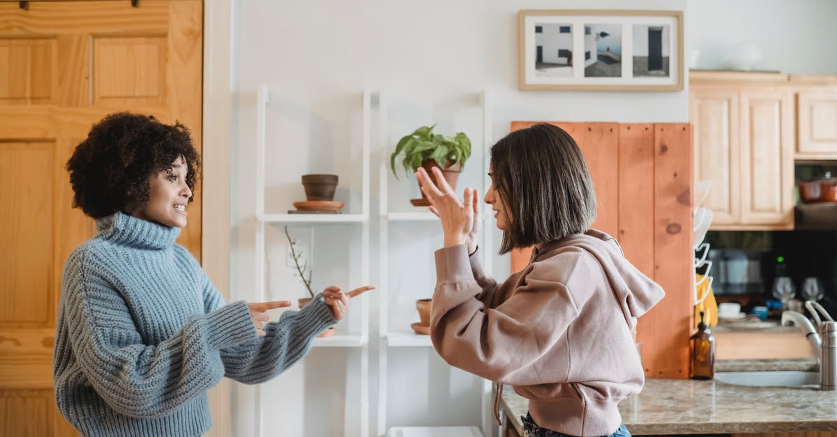 Is it rude to speak Swedish in Norway? - Irritated multiracial women fighting in apartment