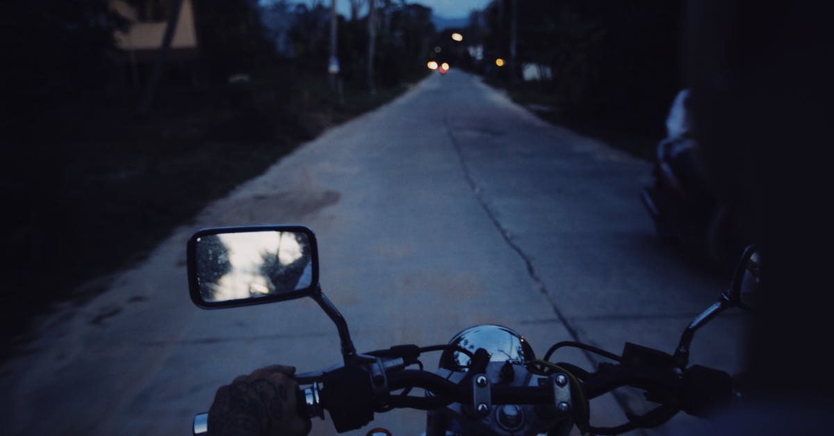 Is it safe to drive at night in the Canadian Rockies? - Person Driving a Motorcycle at Night