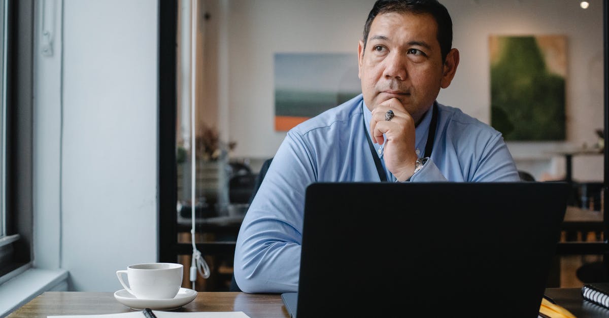 Is Jat Airways reliable? - Thoughtful ethnic businessman using laptop while working in office