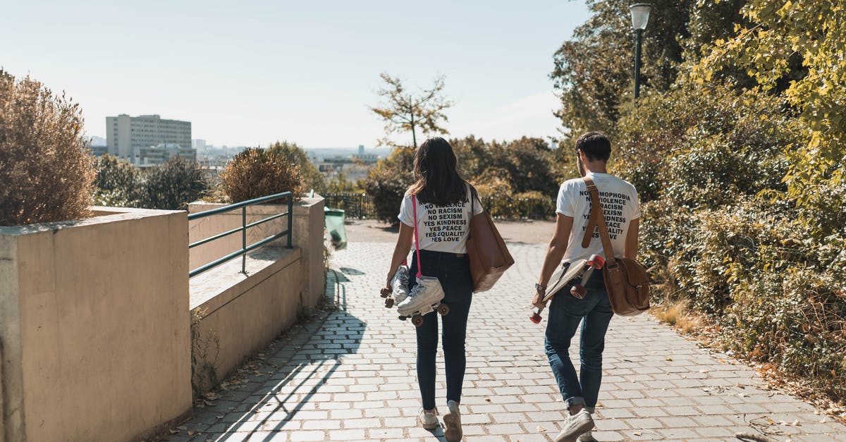 Is leisure travel a valid reason to get a second French passport? - Man and Woman Walking on Paved Bricks Is leisure travel a valid reason to get a second French passport? - Man and Woman Walking on Paved Bricks