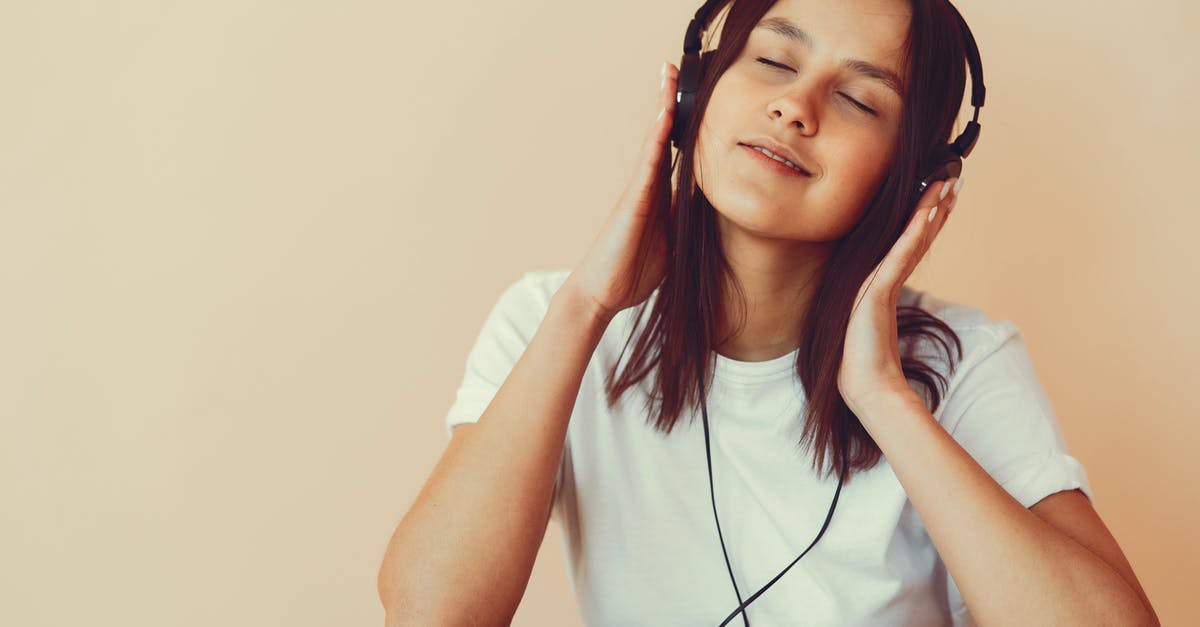 Is March/April a good time to visit Canada? [closed] - Dreamy young woman listening to music in headphones