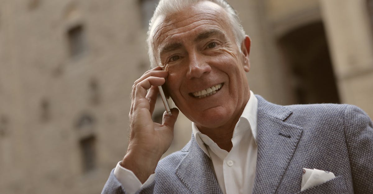 Is my European smartphone already unlocked? [closed] - Man In Gray Suit Smiling