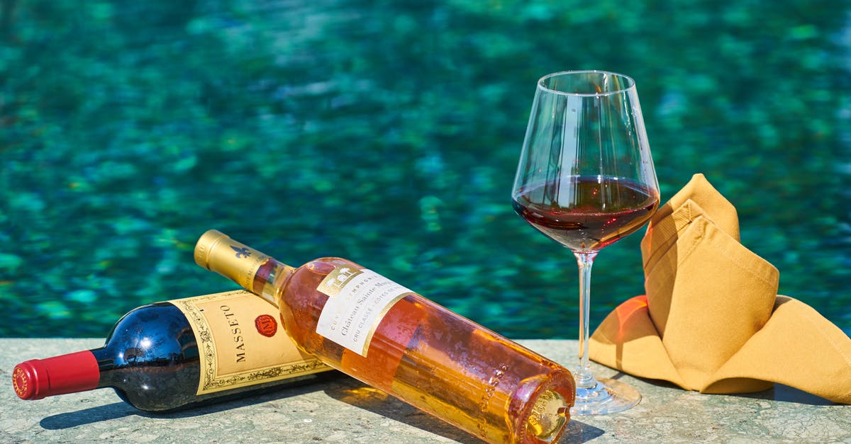 Is Naples (Florida) still affected by Irma aftermath? - Two Labeled  Bottles Of Wine Beside A Wine Glass By The Pool