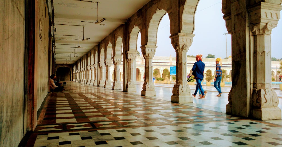 Is New Delhi, India, safe to travel to? (Ebola Scare) - Man in Blue Denim Jeans Walking Entering the Hallway