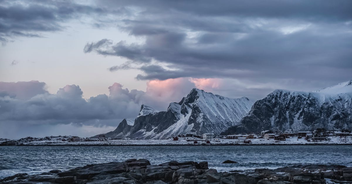 Is Norway significantly more expensive than other European destinations? - Rocky Mountain Near Body of Water Under Cloudy Sky