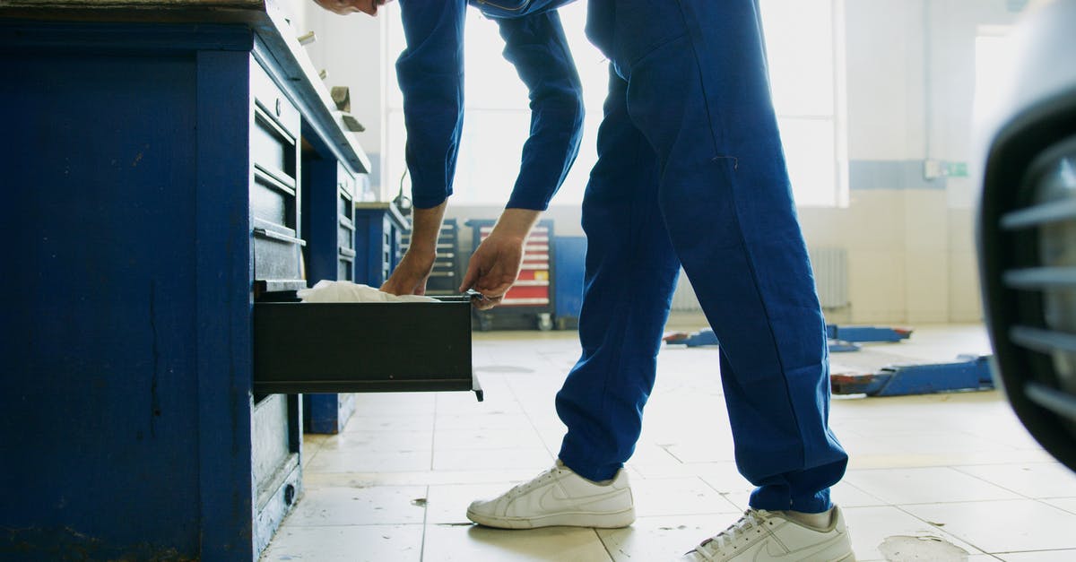 Is not checking in any baggage suspicious? - A Man Opening a Drawer