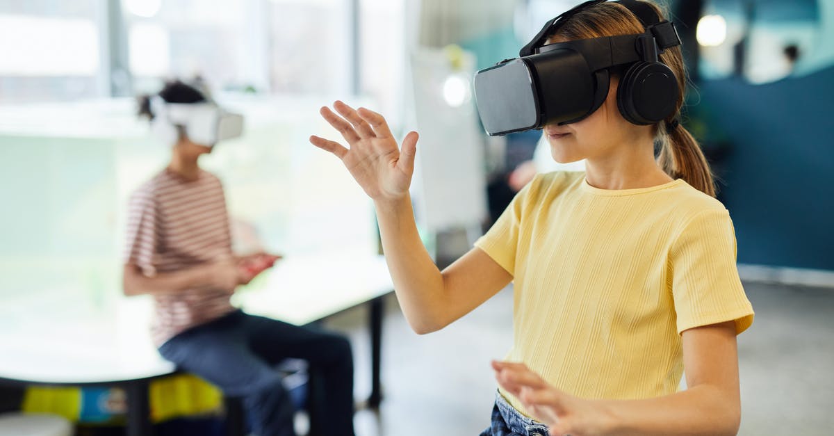 Is PCR test required for a child travelling to Spain? - Young female in VR glasses standing in light room and testing new device