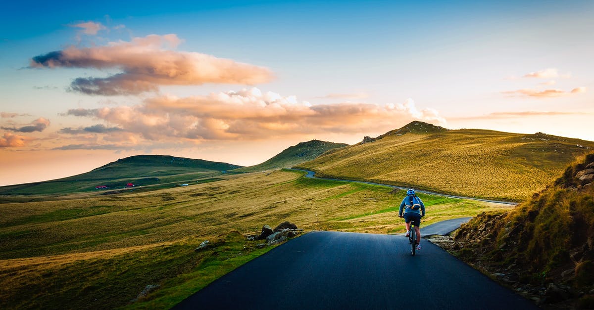 Is properly sealed bottled water ever unsafe, even in developing countries? - Rear View of Man on Mountain Road Against Sky