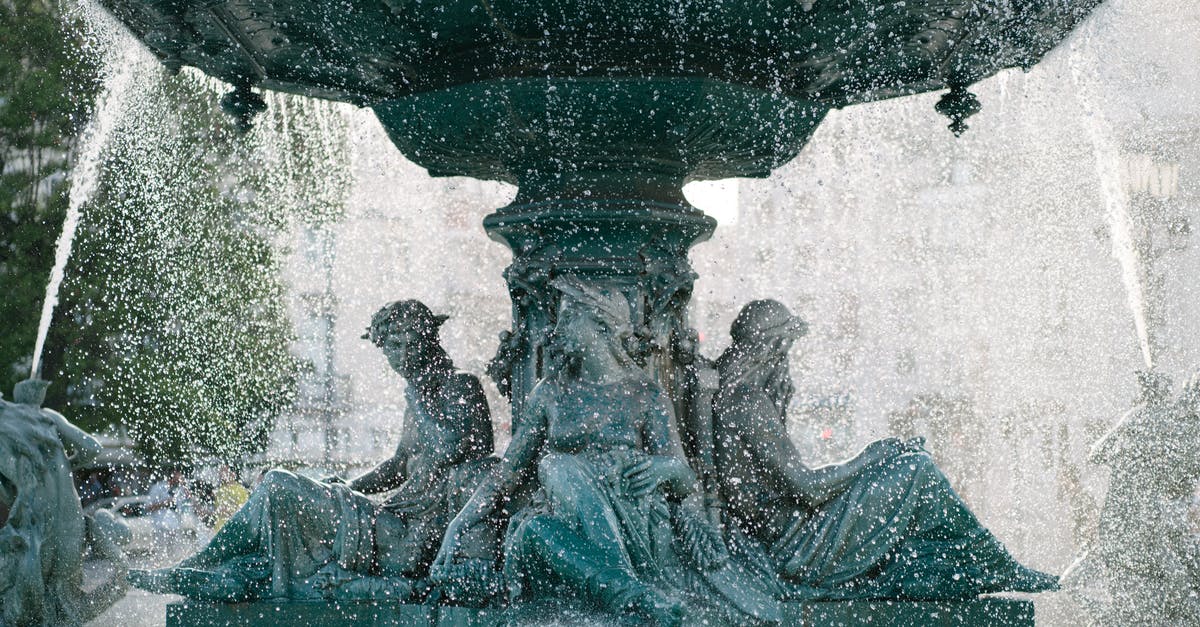 Is Tbilisi a good place to tour after this year's flood? - Bronze sculptures on base of fountain on Rossio Square