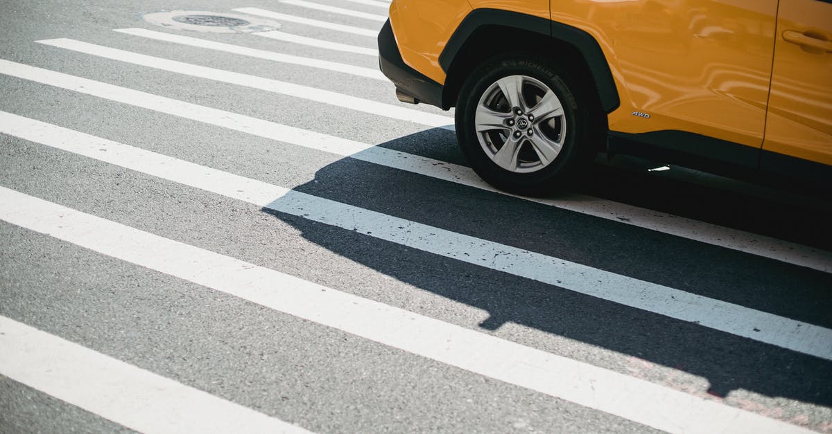 Is the Antequera-Granada high speed line open after 2019-12-15? - Contemporary yellow car driving on pedestrian crossing on city street in sunny day