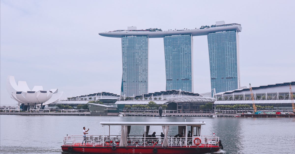Is the ferry between Changi, Singapore and Tanjung Belungkor, Malaysia currently running? - White and Red Boat in the Water