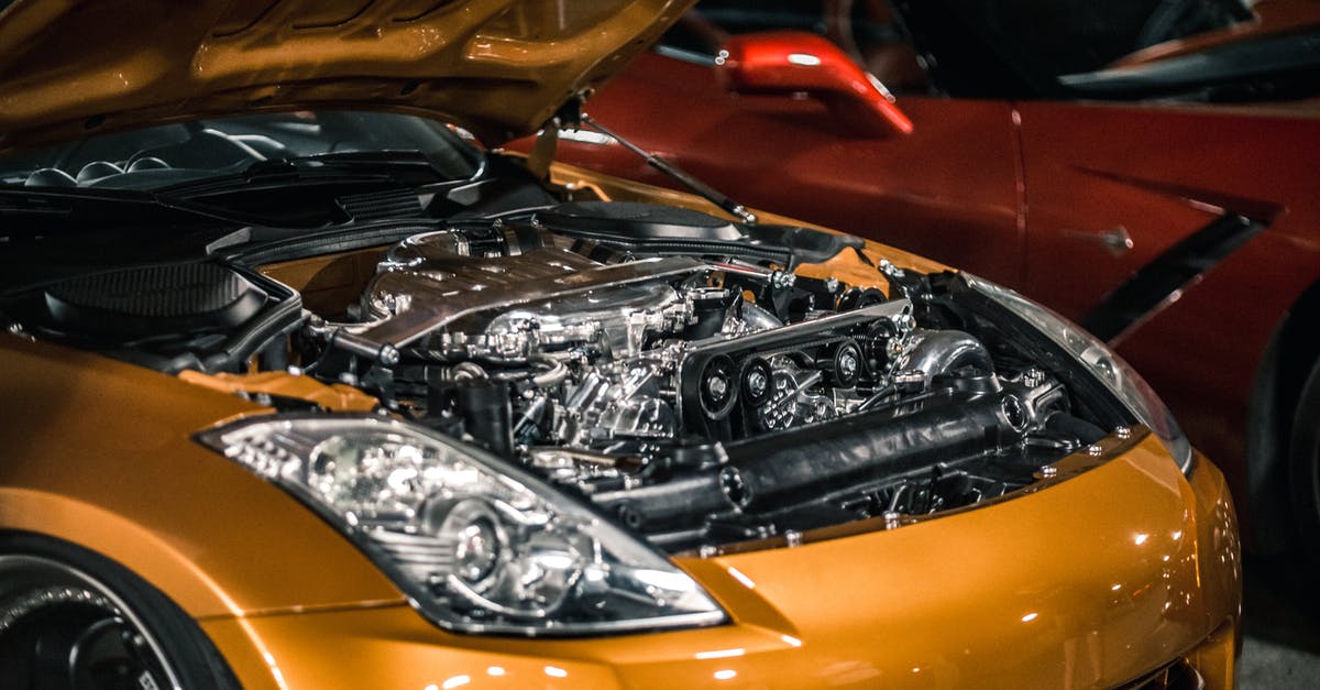 Is the Polish railway system very fragmented? - From above of modern shiny polished engine with details under hood of expensive car parked at parking lot