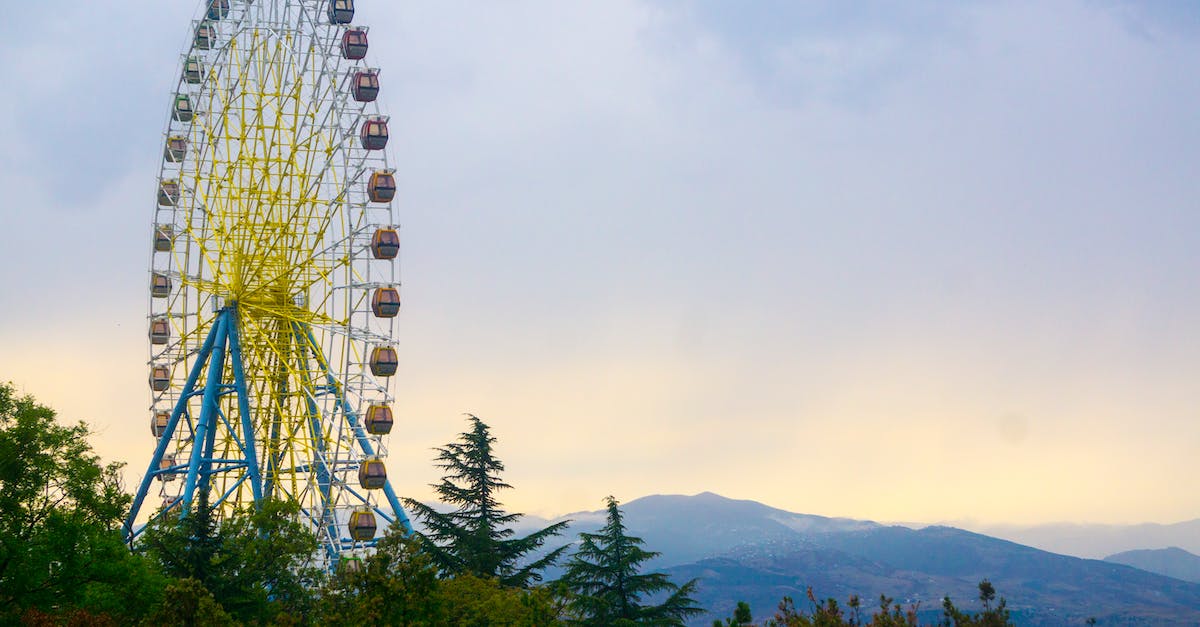 Is there a bus from Tbilisi, Georgia to Thessaloniki, Greece? - Yellow and Brown Ferris Wheel Surrounded by Trees