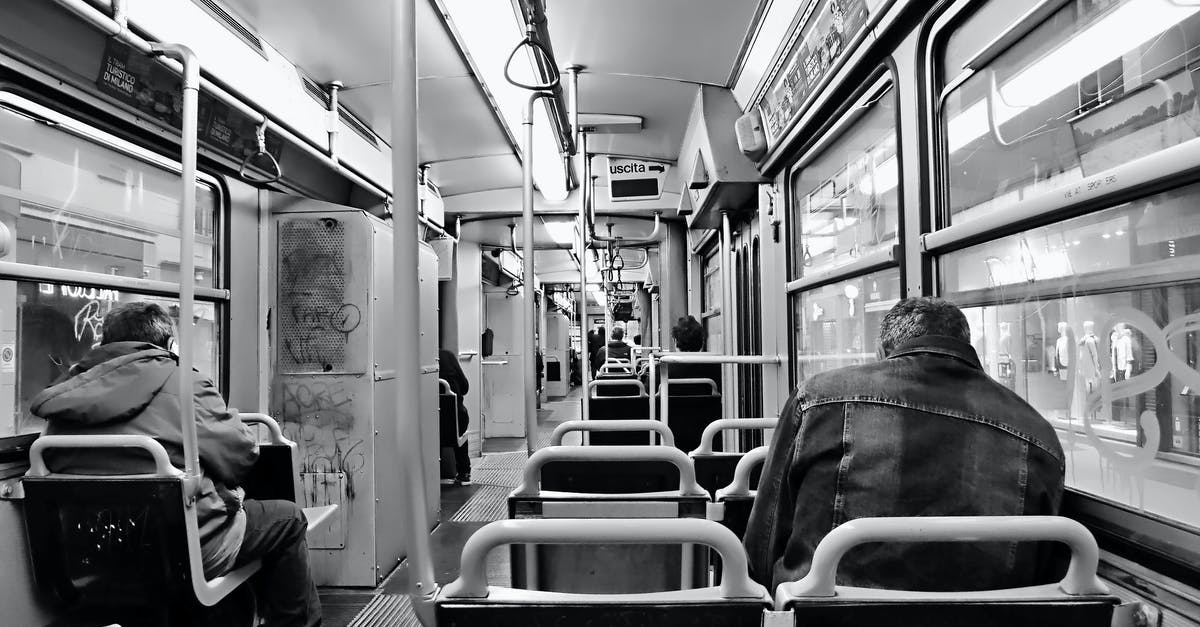 Is there a bus pass for Eastern Canada? - Grayscale Photo of People Sitting Inside Train