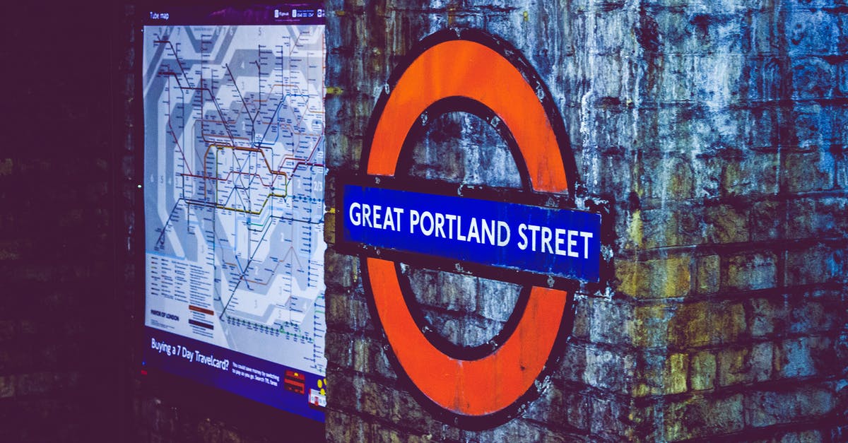 Is there a comprehensive map of the Shinjuku station in Tokyo? - Great Portland Street Signage on Gray Wall