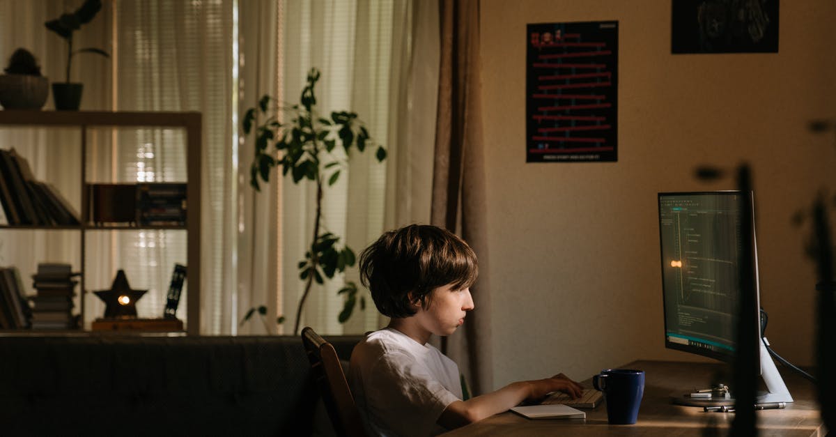 Is there a frequent flyer program catering to children? - Boy in White Shirt Sitting on Chair