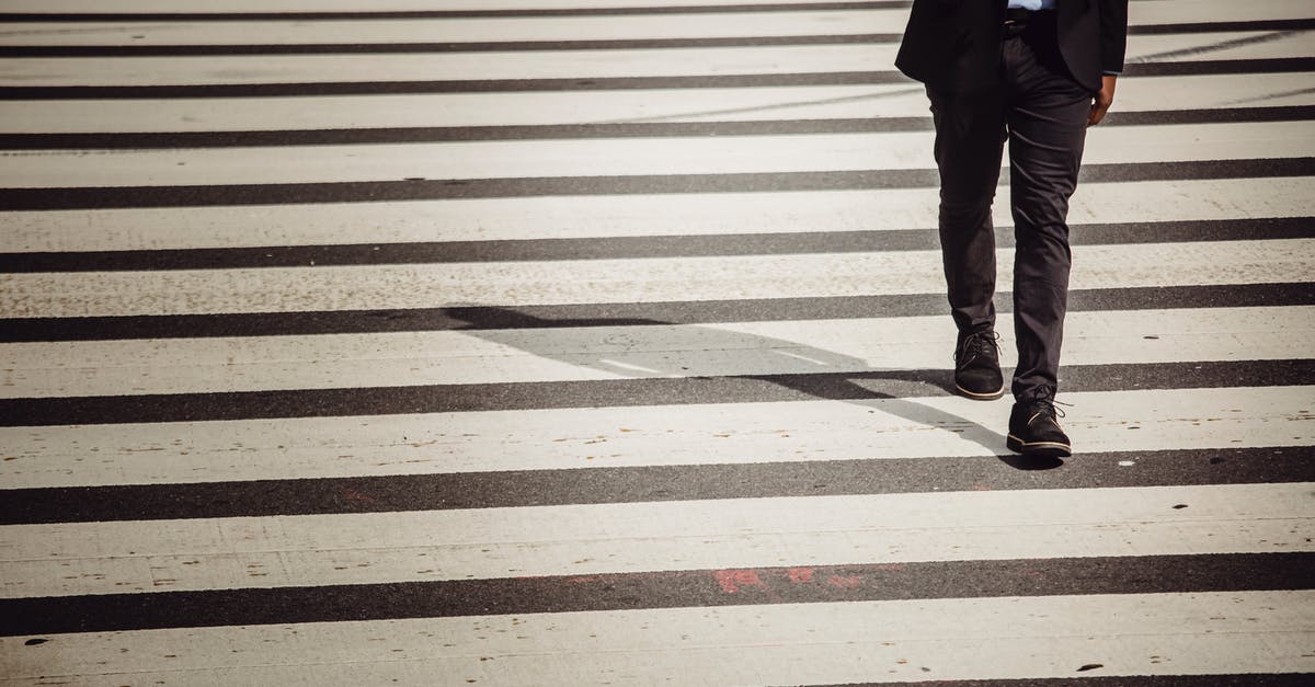 Is there a program that allows non-US/Canadian citizens to avoid going to secondary inspection when crossing the land border? - Faceless businessman with smartphone walking on crosswalk in sunlight Is there a program that allows non-US/Canadian citizens to avoid going to secondary inspection when crossing the land border? - Faceless businessman with smartphone walking on crosswalk in sunlight