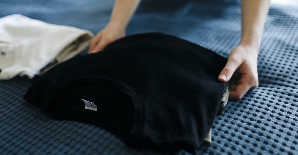 Is there a reason why housekeeping wouldn't accept a tip? - Person Holding Black Nike Cap