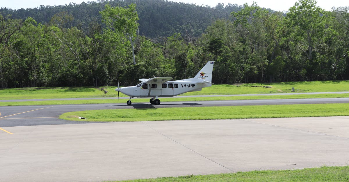 Is there a resource that lists airport taxes? - White and Black Airplane on Green Grass Field