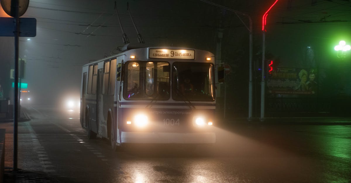 Is there a resource that lists long trip bus companys operating by city, in Europe? - Old trolleybus driving along wet asphalt road in small city at foggy night Is there a resource that lists long trip bus companys operating by city, in Europe? - Old trolleybus driving along wet asphalt road in small city at foggy night