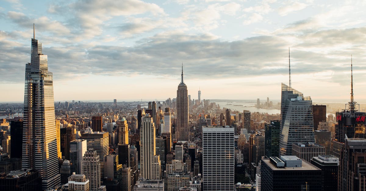 Is there a roof-top bar in the Empire State building? - Contemporary multistory house facades against sea in USA