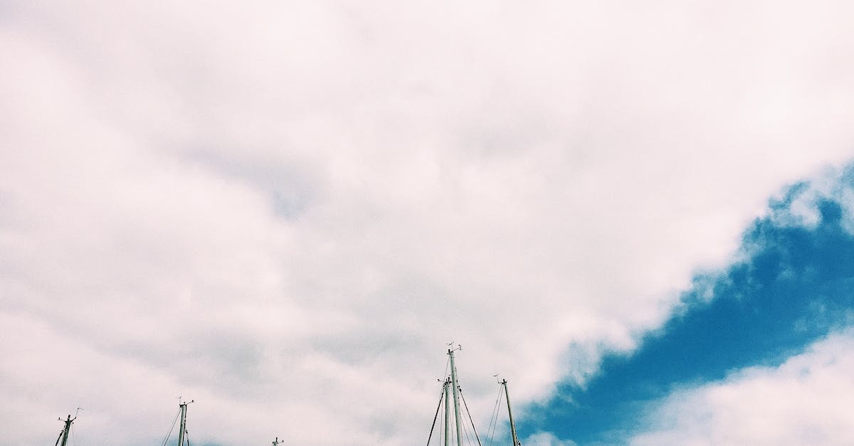 Is there a ship of the line that I can sail on from Britain? - Sailboats with deflated sails under cloudy sky