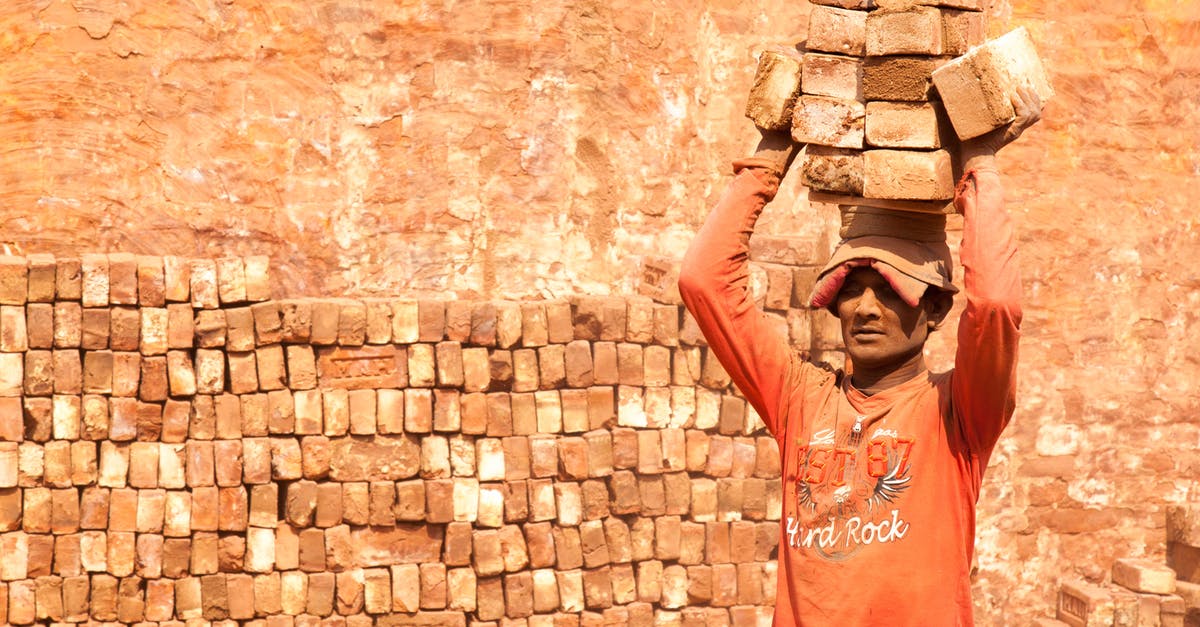 Is there a site with all airlines carry-on restrictions? [duplicate] - Mann In Red Shirt Carrying Brick on His Head