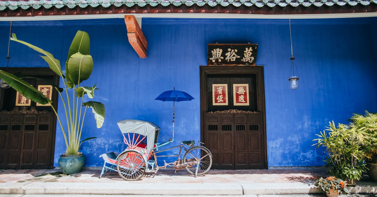 Is there a Yelp equivalent in Malaysia? - Rickshaw and Entrance to House