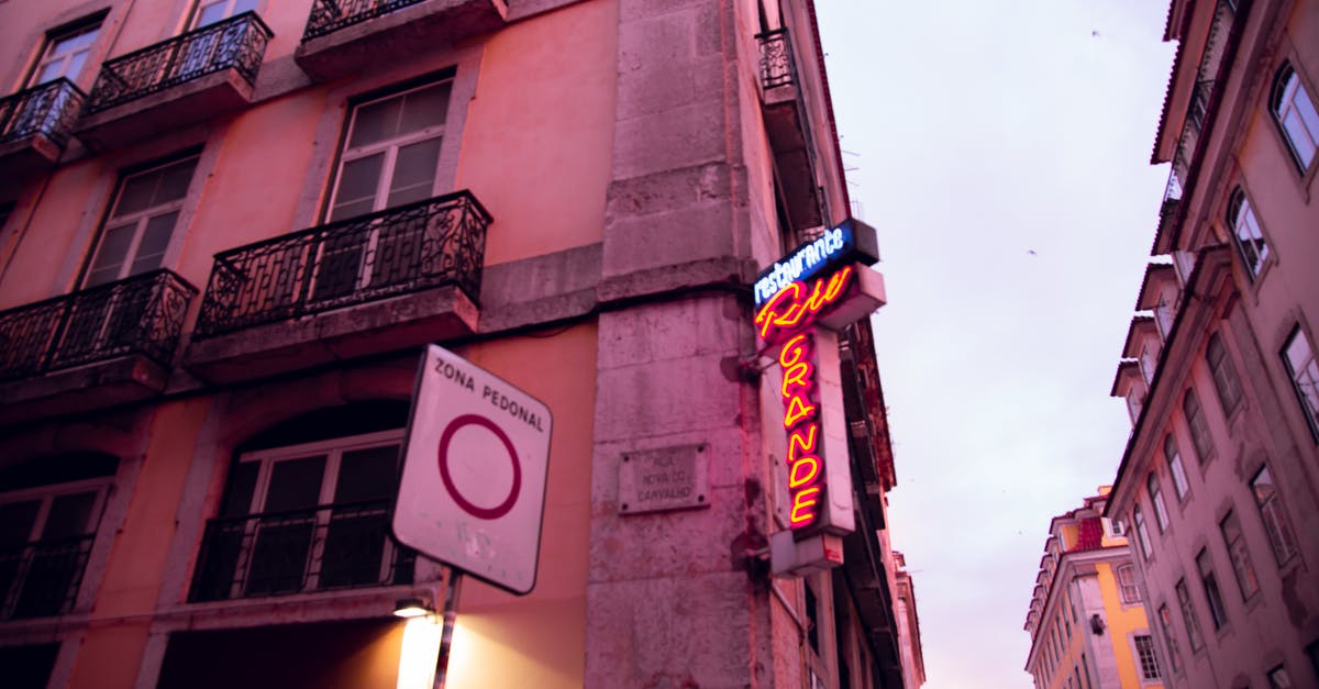 Is there any banned area to travelers in China apart from Tibet? - Old residential building with signboard in twilight