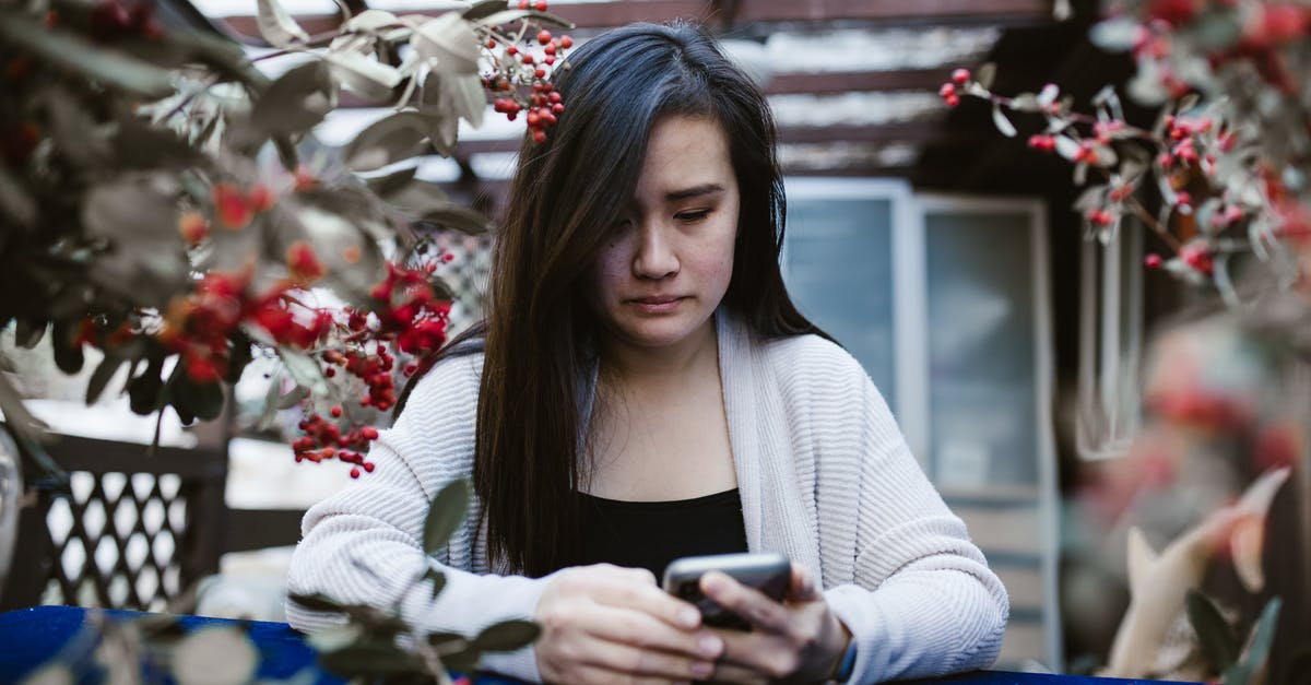 Is there any legal "calm/silent/quiet time" in the Netherlands? - Woman in White Sweater Holding Black Smartphone