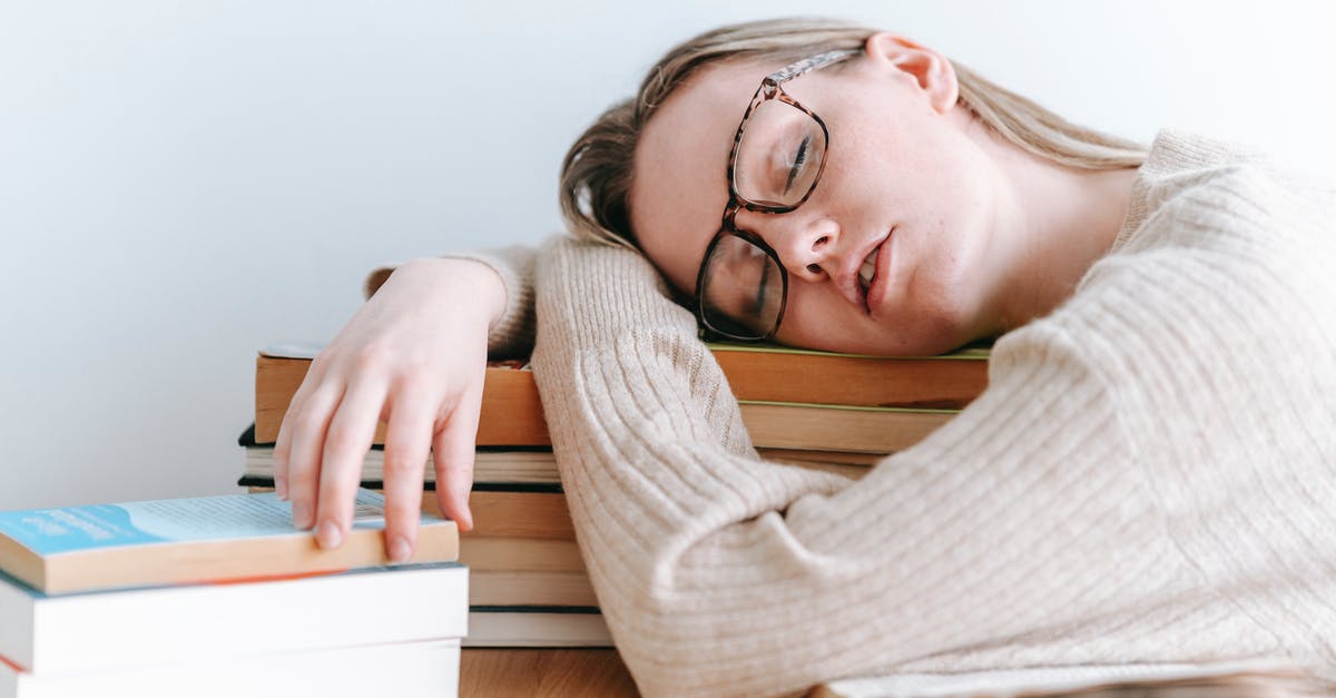 Is there any problem if I booked Multi Destinations ticket? [duplicate] - Exhausted female student in eyeglasses and casual sweater sitting at table and sleeping on books on light room