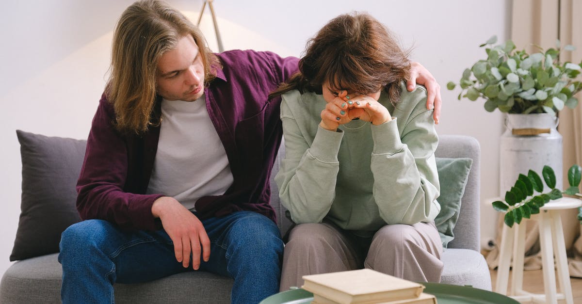 Is there any problem if I booked Multi Destinations ticket? [duplicate] - Young male in jeans comforting depressed upset female crying on gray sofa near table with books