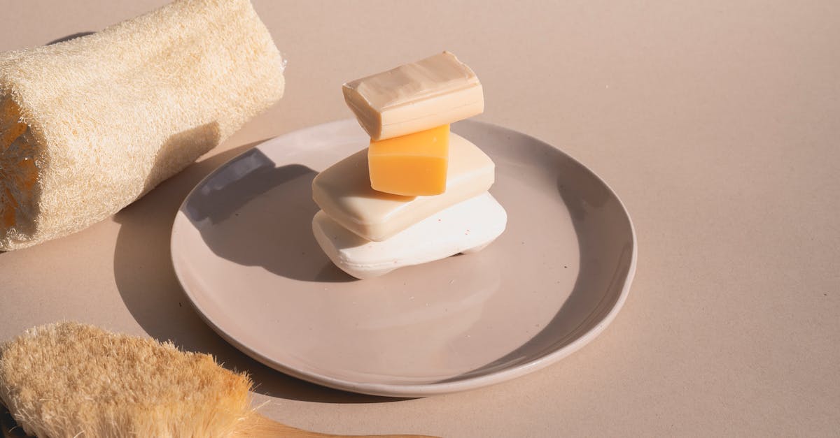 Is there any reason not to do laundry with bar soap? - A Stack of Bar Soaps on Ceramic Plate