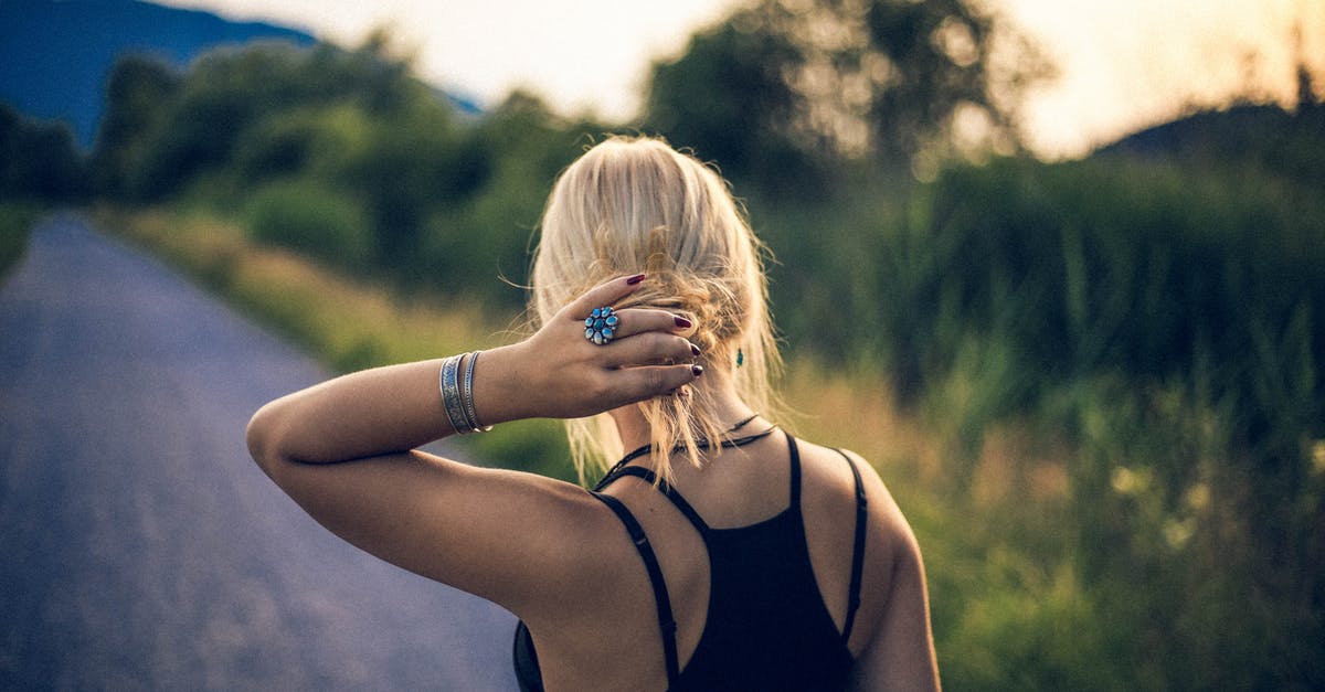 Is there any way to extend my visa? [closed] - Woman Holder Her Hair Outdoors