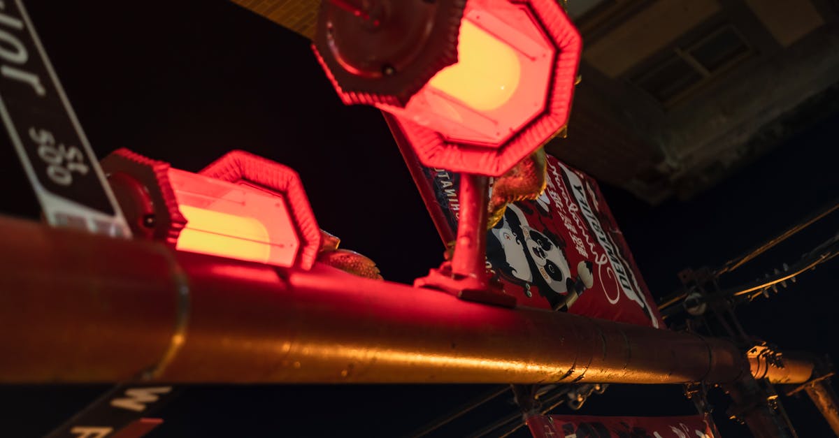 Is there any way to find out what happened to a post card sent from other country? [closed] - Signpost with decorative lanterns in evening town