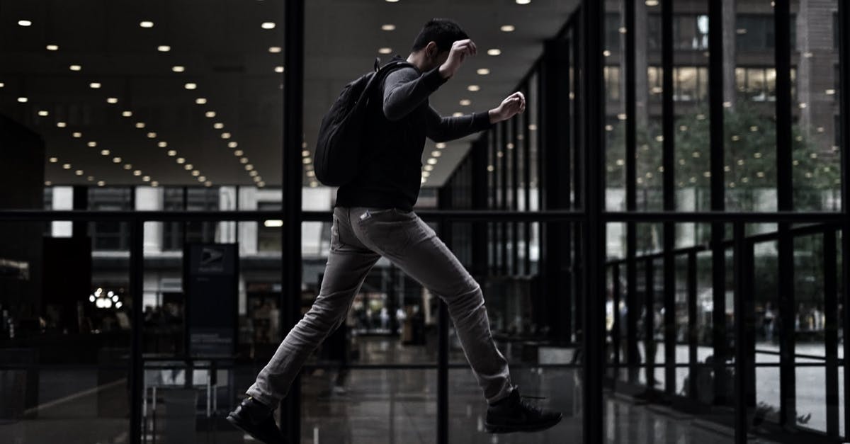 Is there camping gear specifically designed to fit modern air traveling? - Unrecognizable man stepping onto concrete platform in modern style building