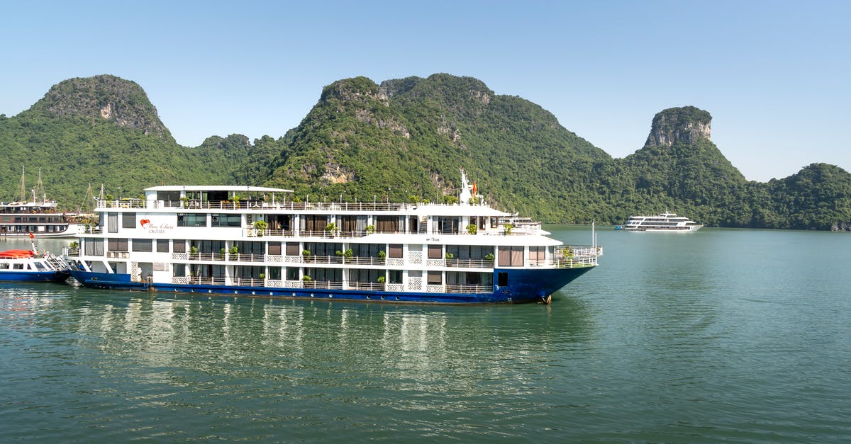 Is there ferry service from Vietnam to Borneo? - White and Blue Ship on Sea