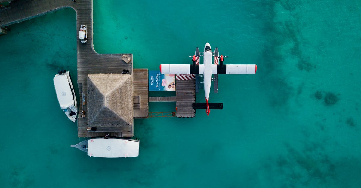 Is there such a thing as individual tourism with water plane? - Seaplane on water near bungalow