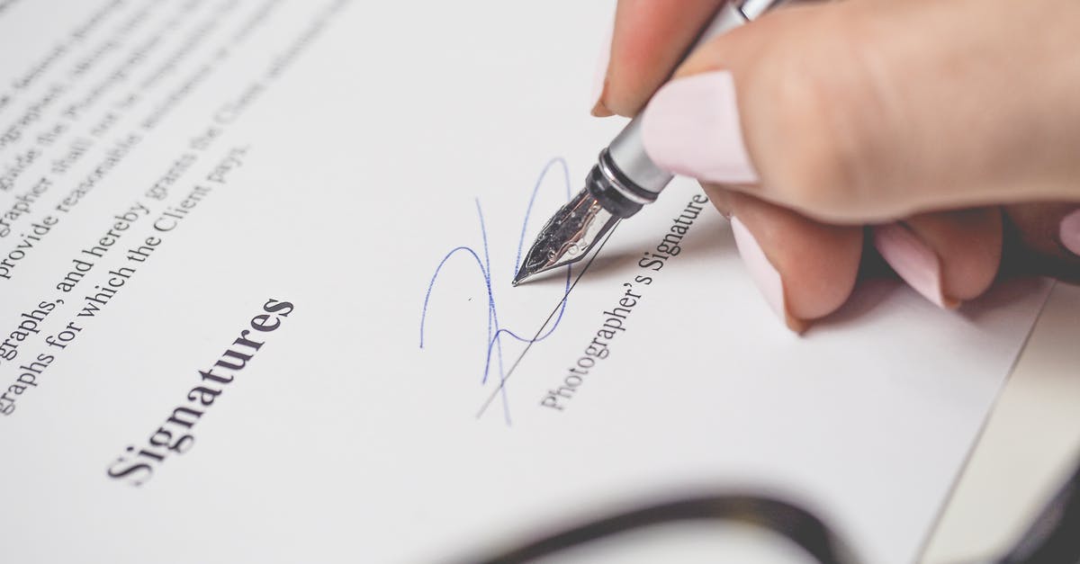 is this a chip & signature amex? [closed] - Person Holding Silver Pen Signing Photographers Signature