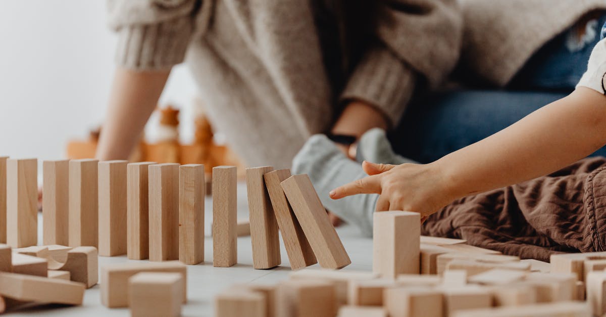 Is tipping expected in Indonesia? - Photo of a Child's Hand Tipping Wooden Blocks