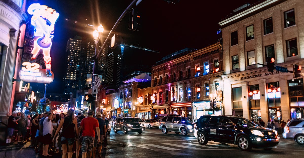 Is tipping mandatory at Restaurants and Bars in Germany? - Illuminated Busy Street at Night