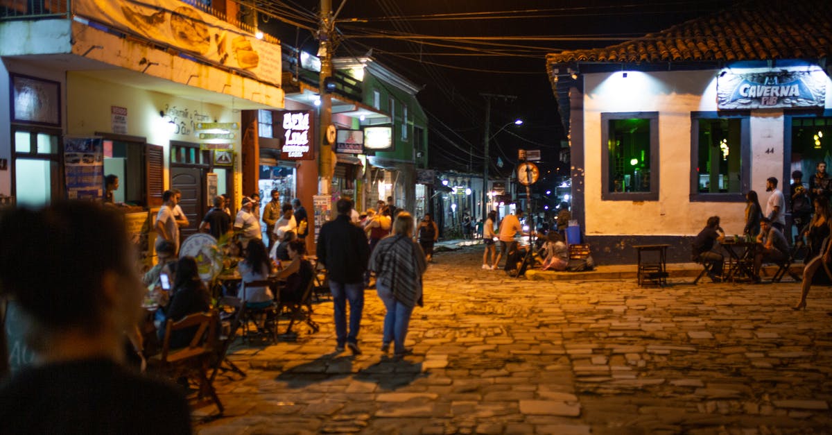 Is tipping mandatory at Restaurants and Bars in Germany? - People Outside the Building during Nighttime