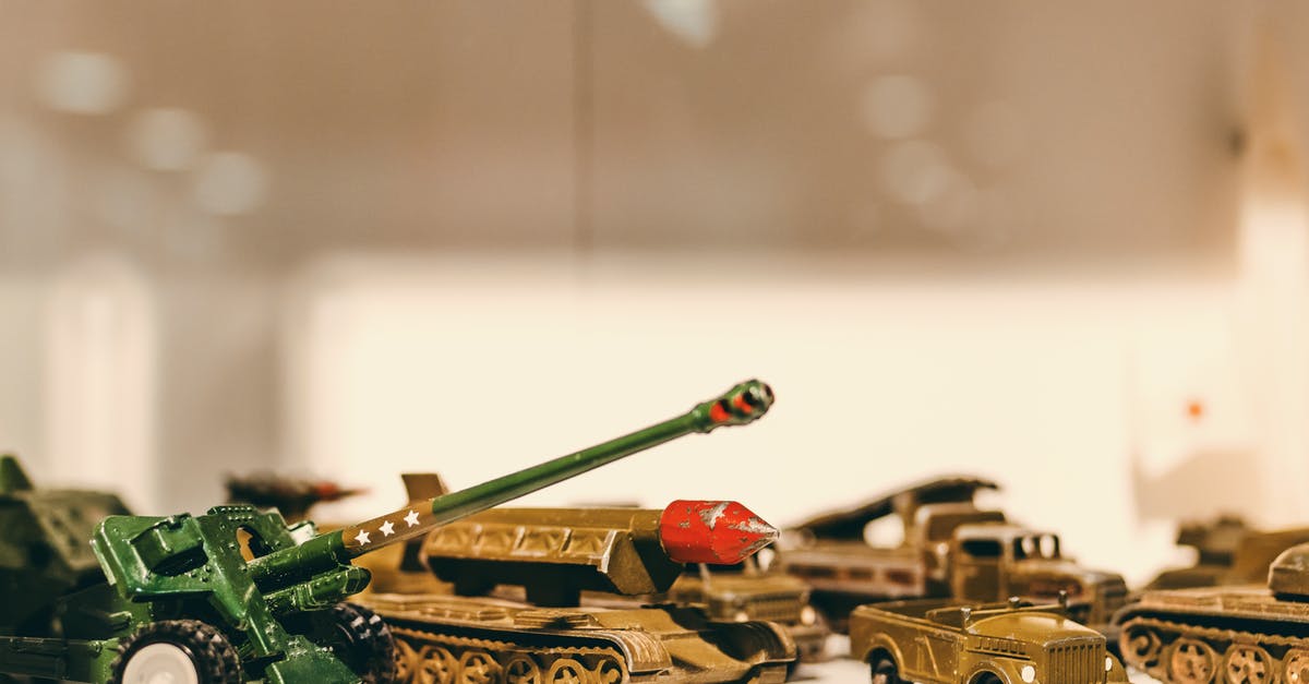 Is toy metal gun allowed on a Turkish Airways? - Selective Focus Photography of Die Cast Model Combat Vehicles