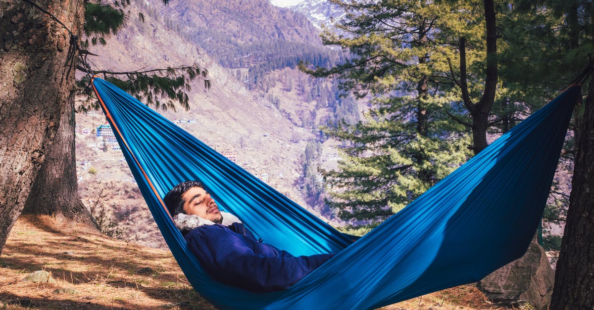 Is travelling allowed in Uttarakhand without E-pass? - A Male Traveler Sleeping in a Blue Hammock