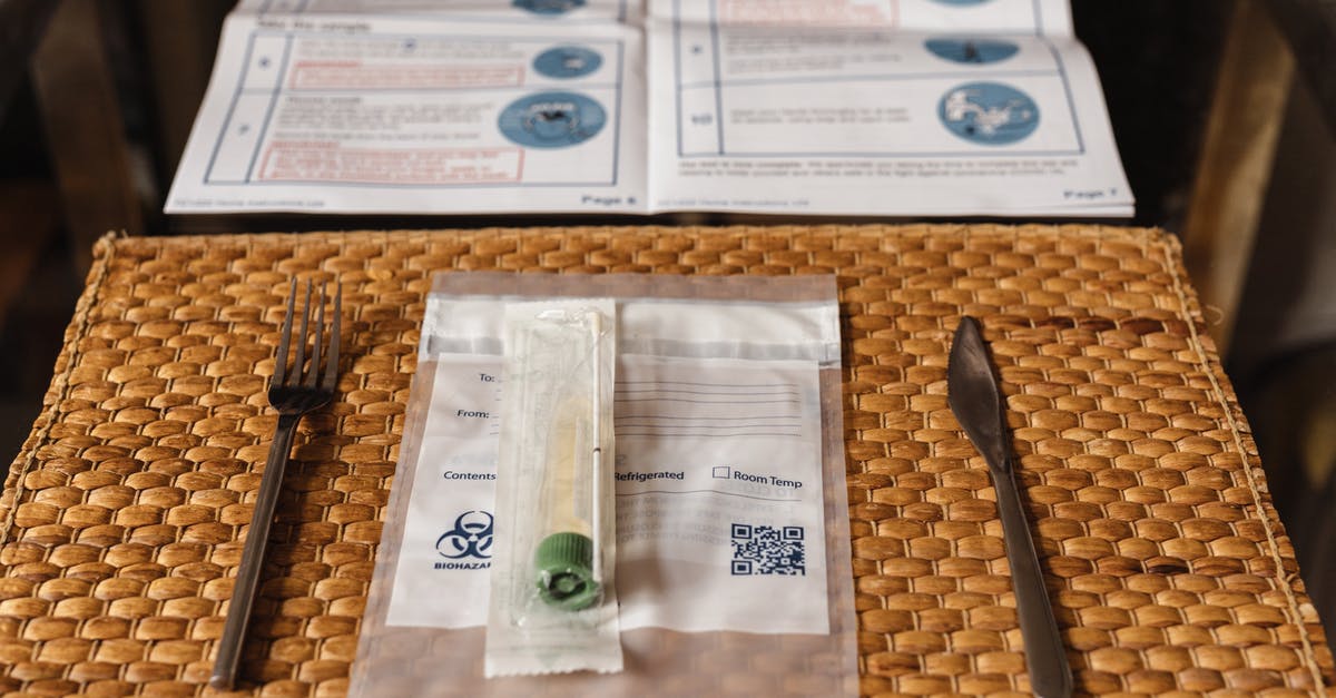 Is Turkey still doing random COVID PCR tests on incoming passengers? - Swab Testing Kit on a Straw Placemat on a Glass Table