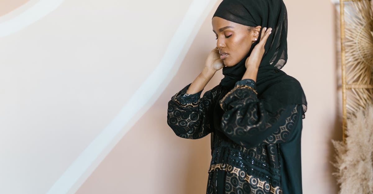 Islamic art museums / Galleries in Dubai - Woman in Black Hijab Covering Her Face