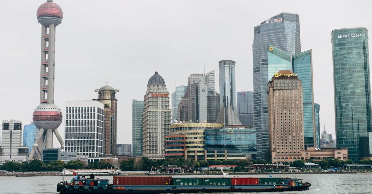 Israeli passport on ferry from China to Taiwan - Photo Of Building During Daytime