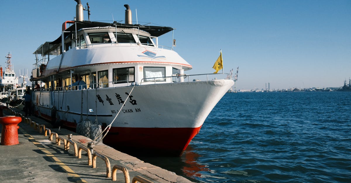 Israeli passport on ferry from China to Taiwan - A Boat Docked Near the Concrete Pier