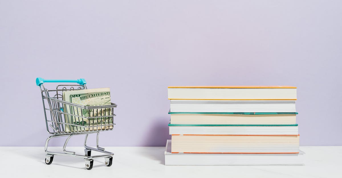 Issue with money order for Canadian visa - Stack of Books Beside A Shopping Cart With Cash Money